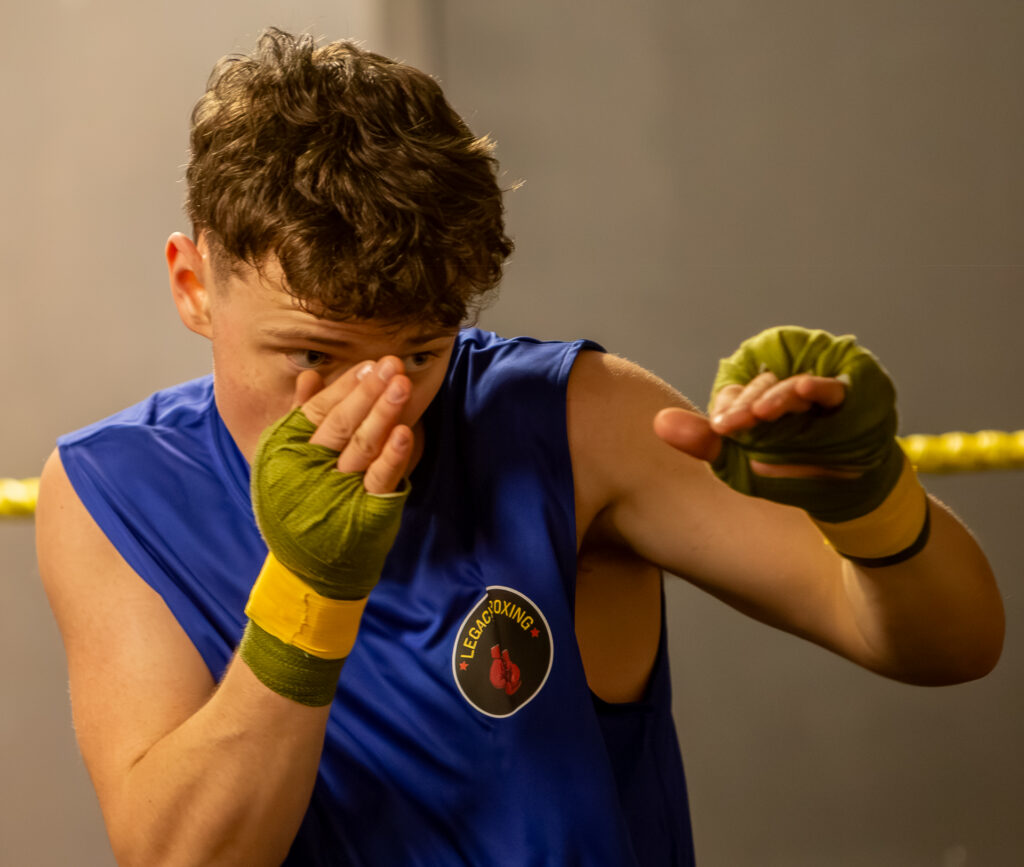 Legacy Boxing athlete training in blue