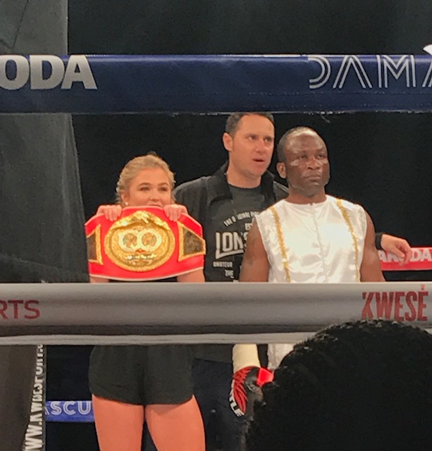 Coach George Campanis ringside with a championship belt
