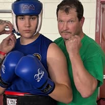 Coach Mark Flynn with a Legacy Boxing athlete