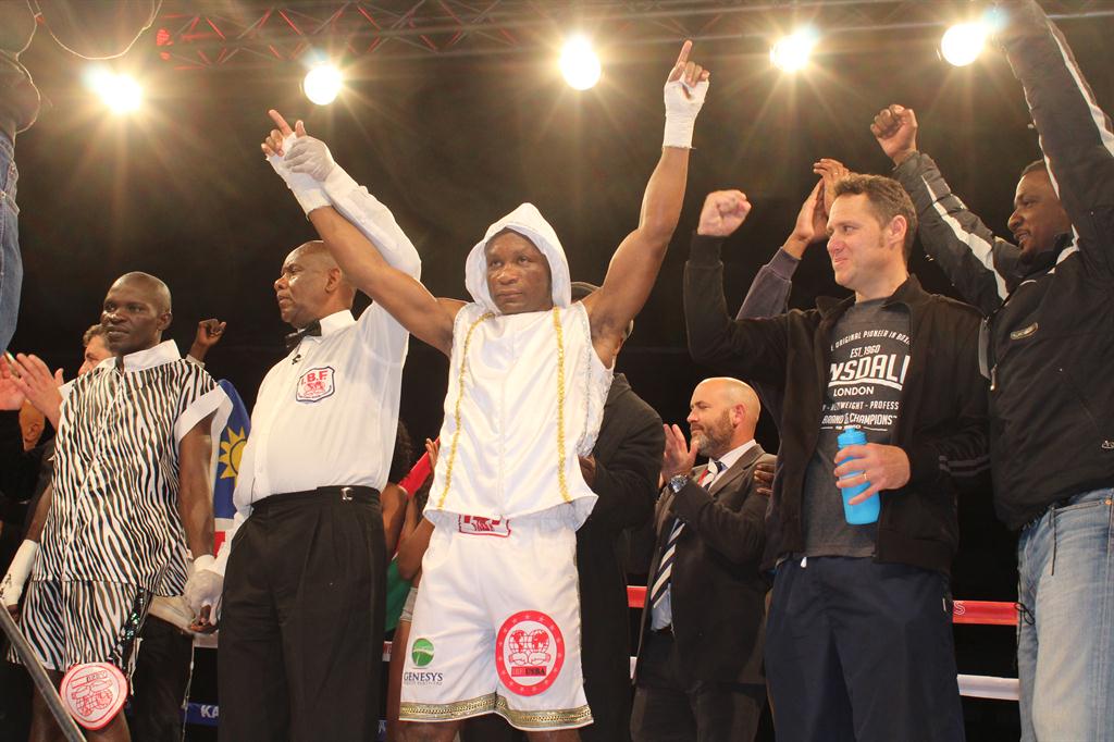 Danny Boy Felesianu celebrating a professional victory with Coach George Campanis