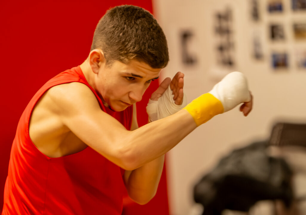 Legacy Boxing athlete training in red